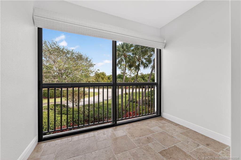 13204 Harbour Ridge Boulevard, Unit 2A Palm City, FL 34990 - Photo 14 of 38 a view of a room with sliding window