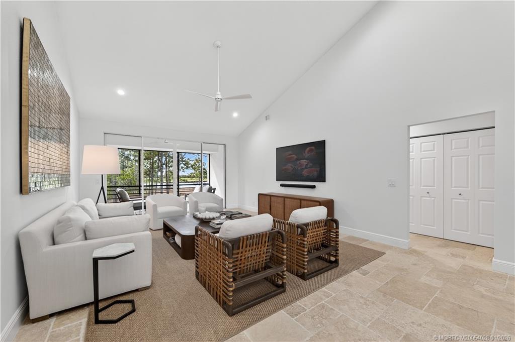 13204 Harbour Ridge Boulevard, Unit 2A Palm City, FL 34990 - Photo 3 of 38 a living room with furniture and a flat screen tv