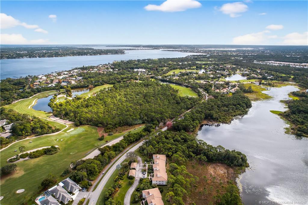 13204 Harbour Ridge Boulevard, Unit 2A Palm City, FL 34990 - Photo 32 of 38 an aerial view of residential houses with outdoor space