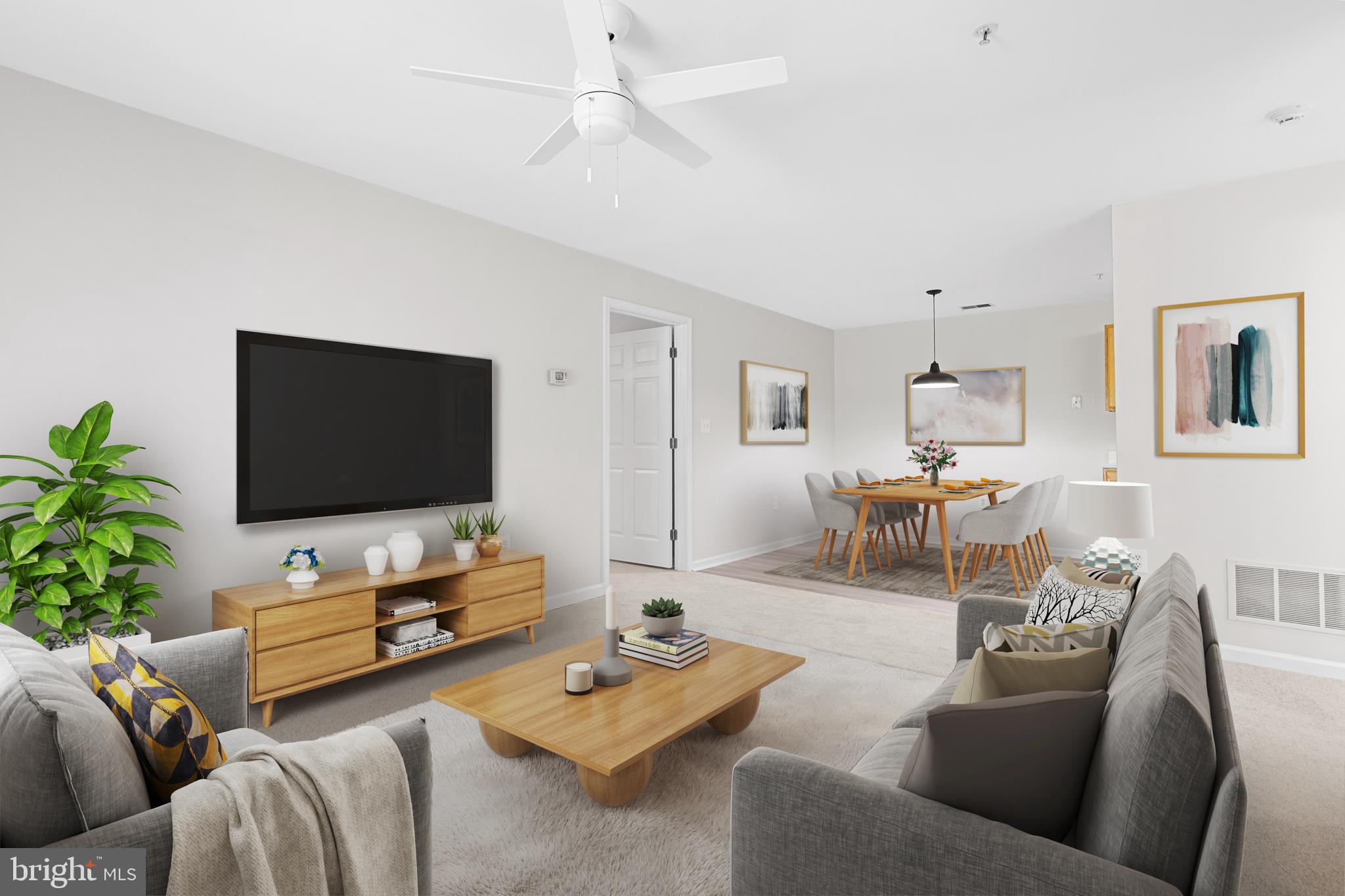 6504 Ridenour Way East, Unit 2C Sykesville, MD 21784 - Photo 14 of 32 a living room with furniture and a flat screen tv