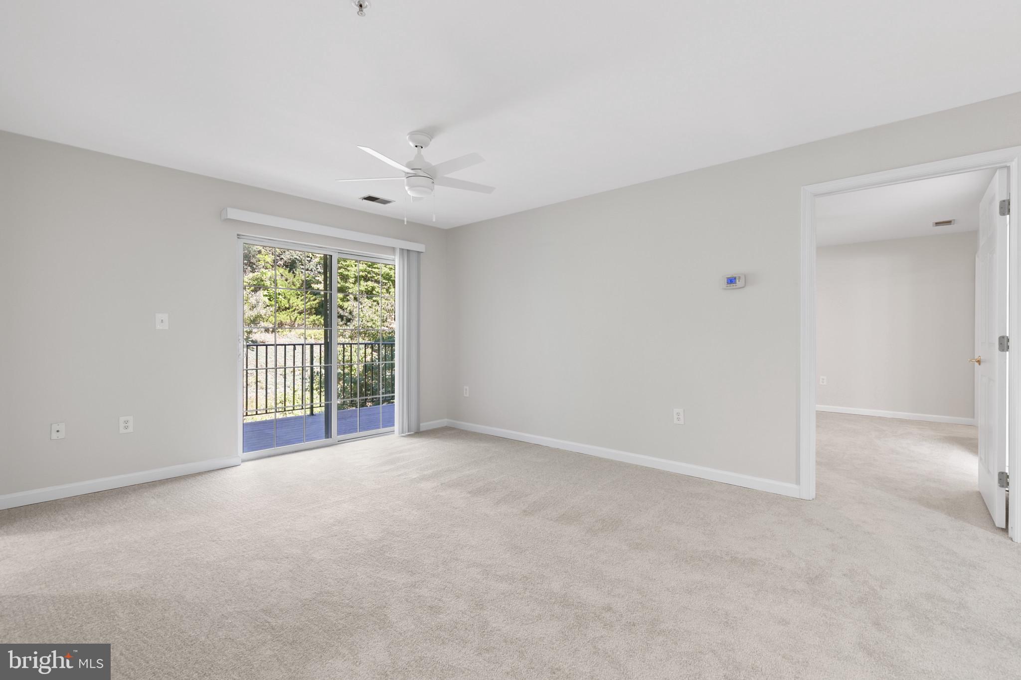6504 Ridenour Way East, Unit 2C Sykesville, MD 21784 - Photo 15 of 32 an empty room with windows and closet