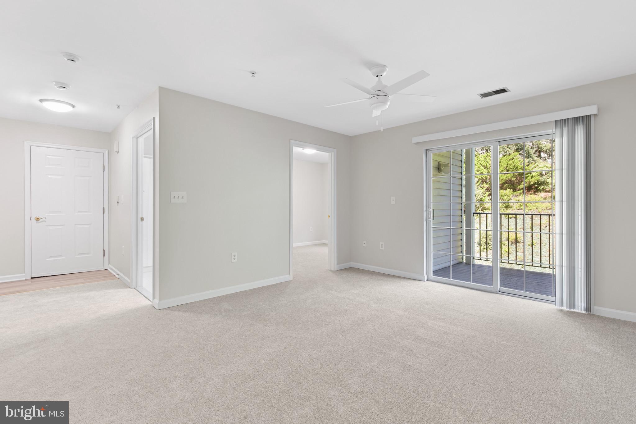 6504 Ridenour Way East, Unit 2C Sykesville, MD 21784 - Photo 17 of 32 a view of an empty room with a window