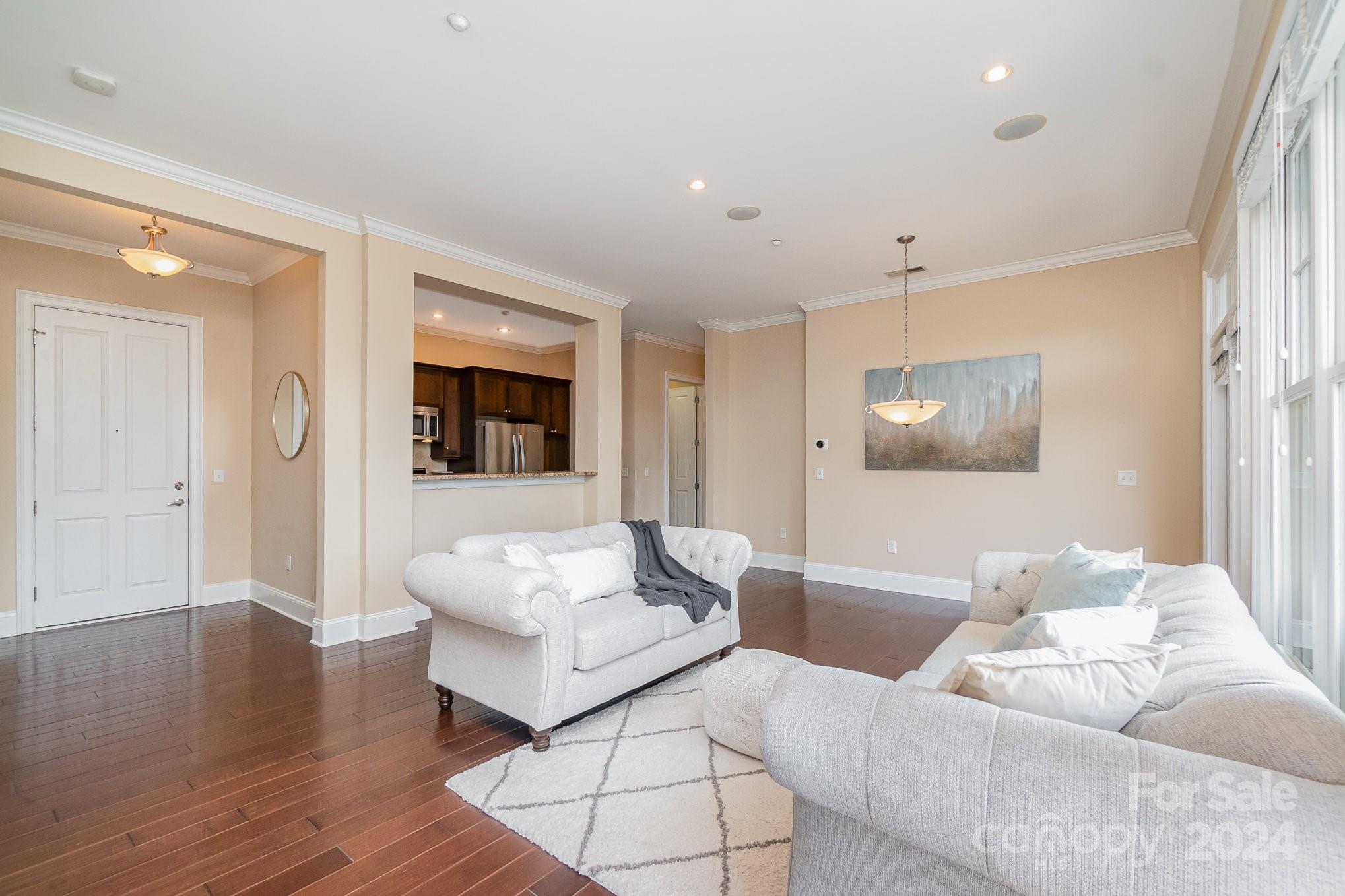 5425 Closeburn Road, Unit 213 Charlotte, NC 28210 - Photo 13 of 32 a living room with furniture and a flat screen tv