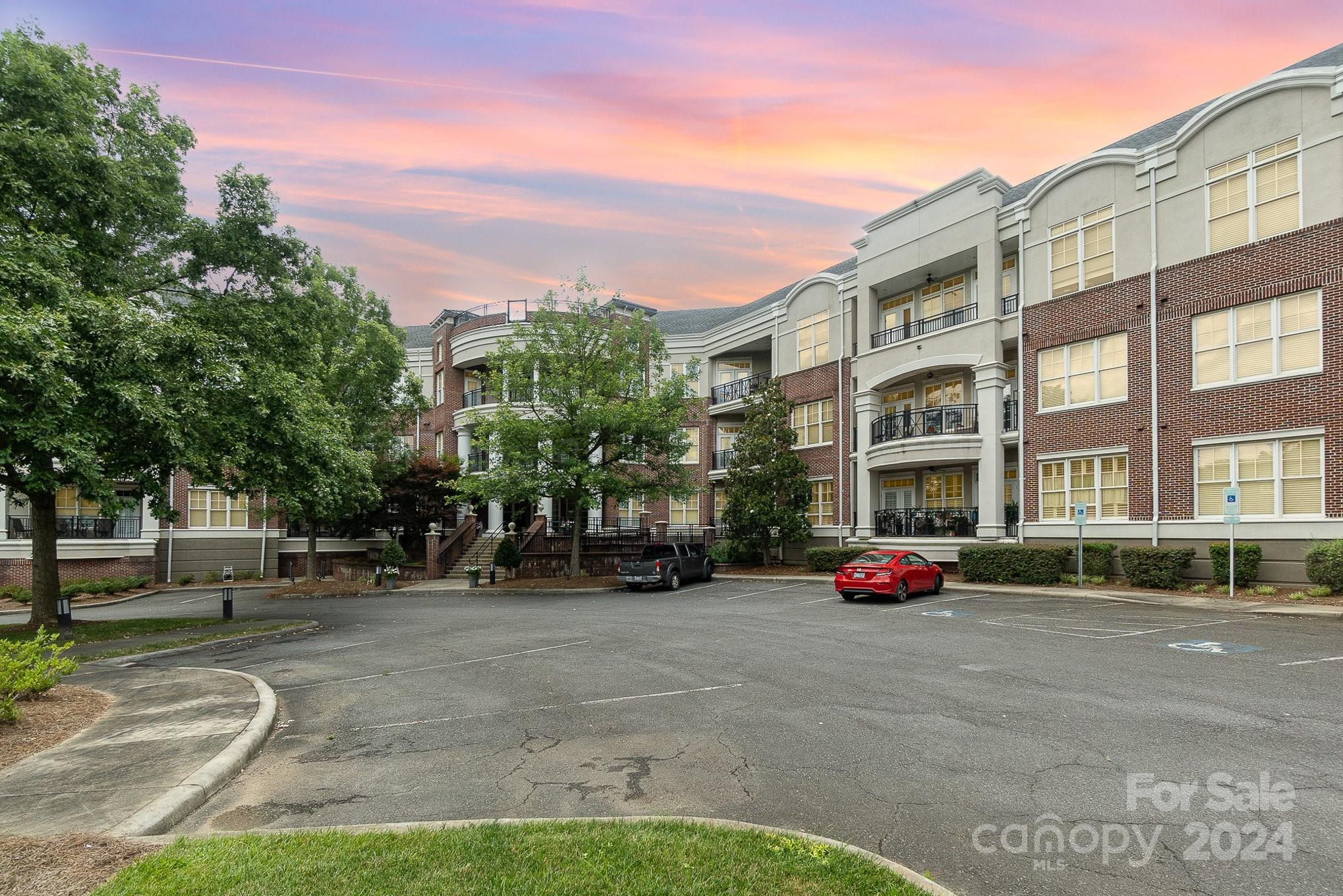 5425 Closeburn Road, Unit 213 Charlotte, NC 28210 - Photo 2 of 32 a building with trees in front of it