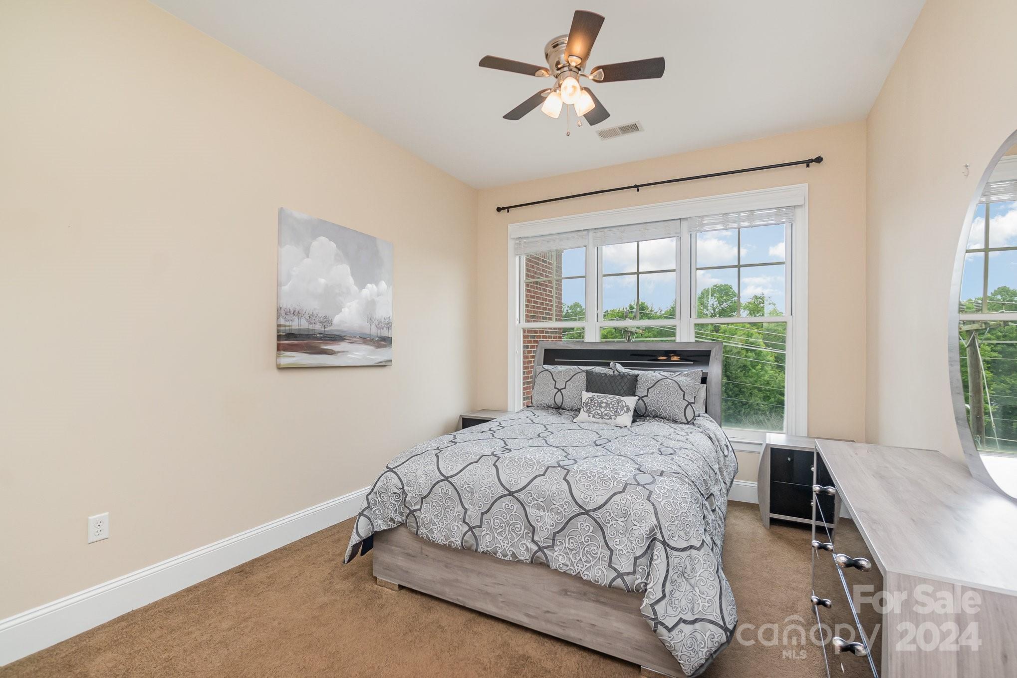5425 Closeburn Road, Unit 213 Charlotte, NC 28210 - Photo 24 of 32 a bedroom with a bed and a window