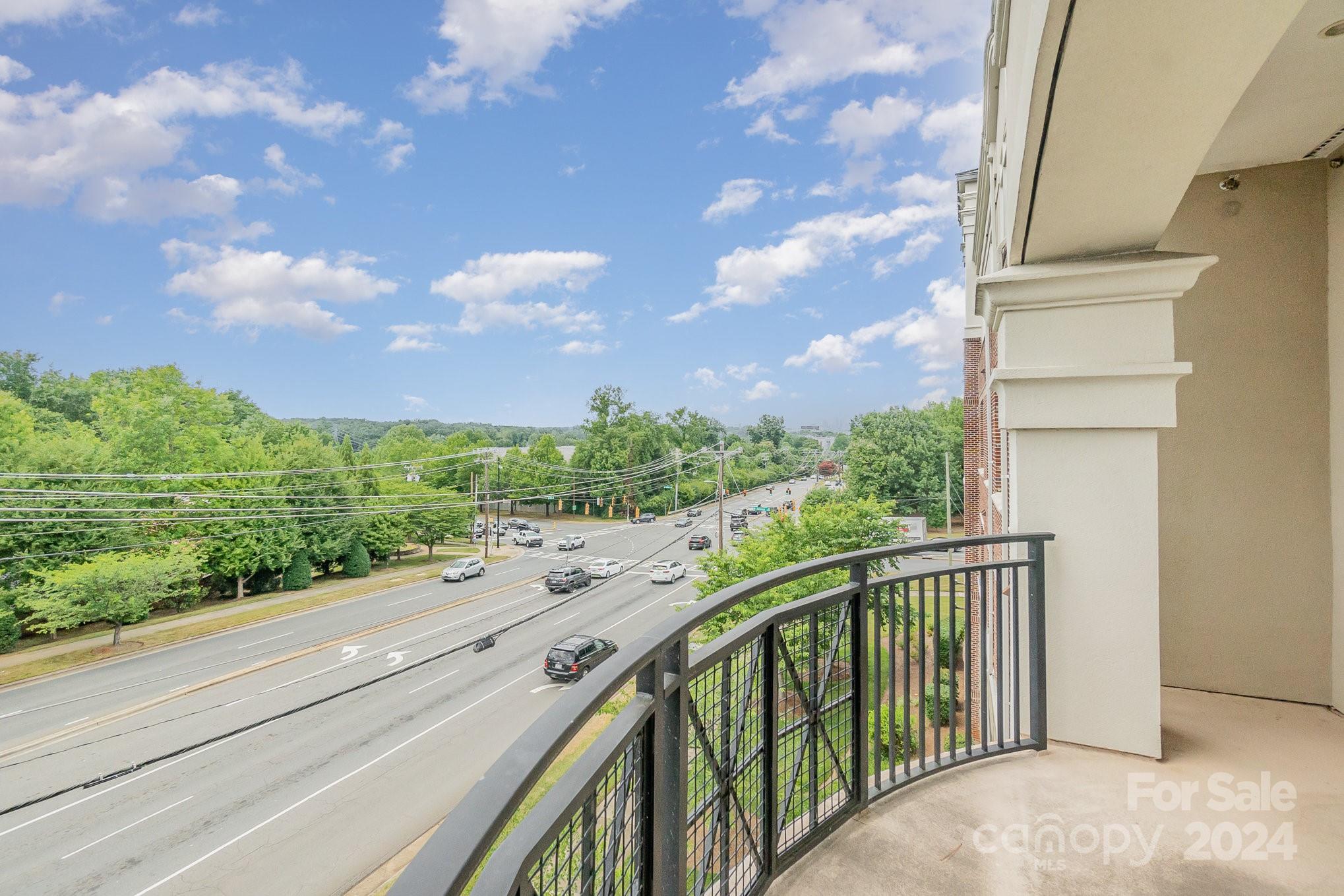 5425 Closeburn Road, Unit 213 Charlotte, NC 28210 - Photo 29 of 32 a view of a balcony with an outdoor space