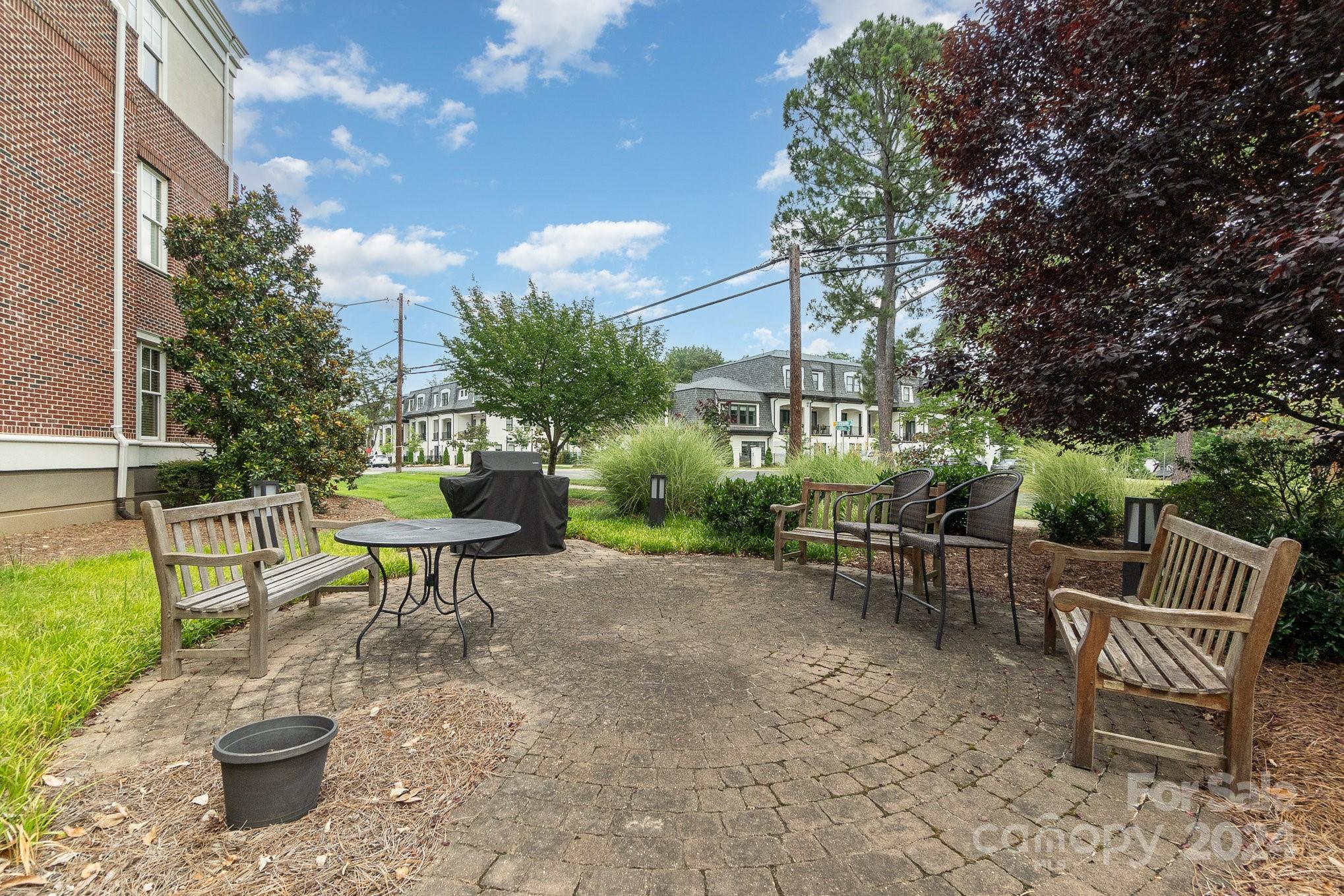 5425 Closeburn Road, Unit 213 Charlotte, NC 28210 - Photo 32 of 32 a chairs and a table in a backyard
