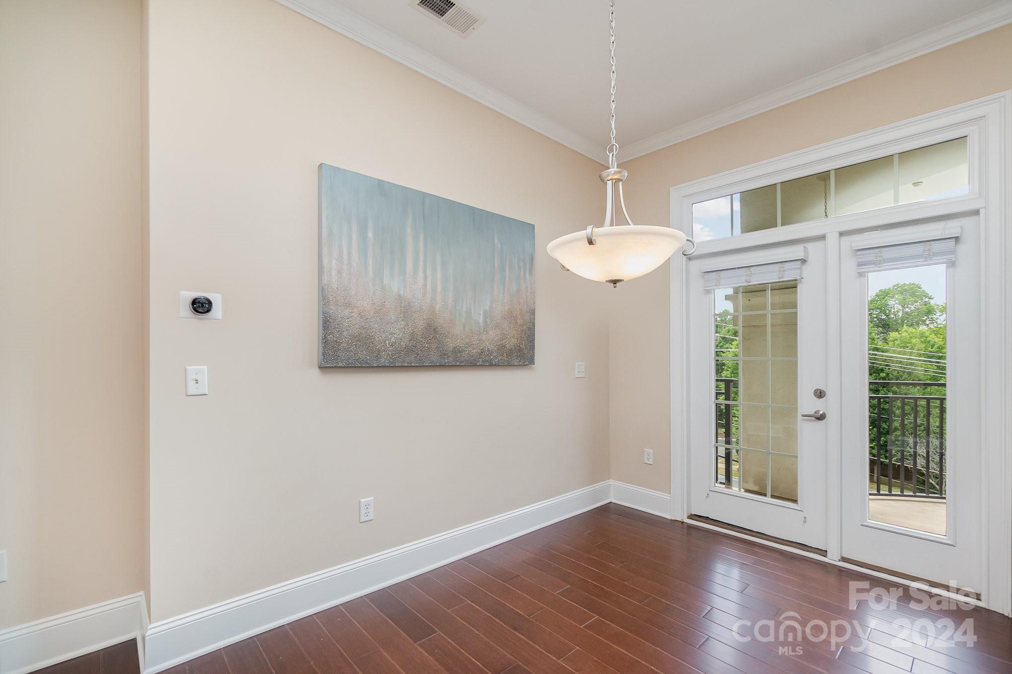 5425 Closeburn Road, Unit 213 Charlotte, NC 28210 - Photo 4 of 32 a view of a room with wooden floor and windows