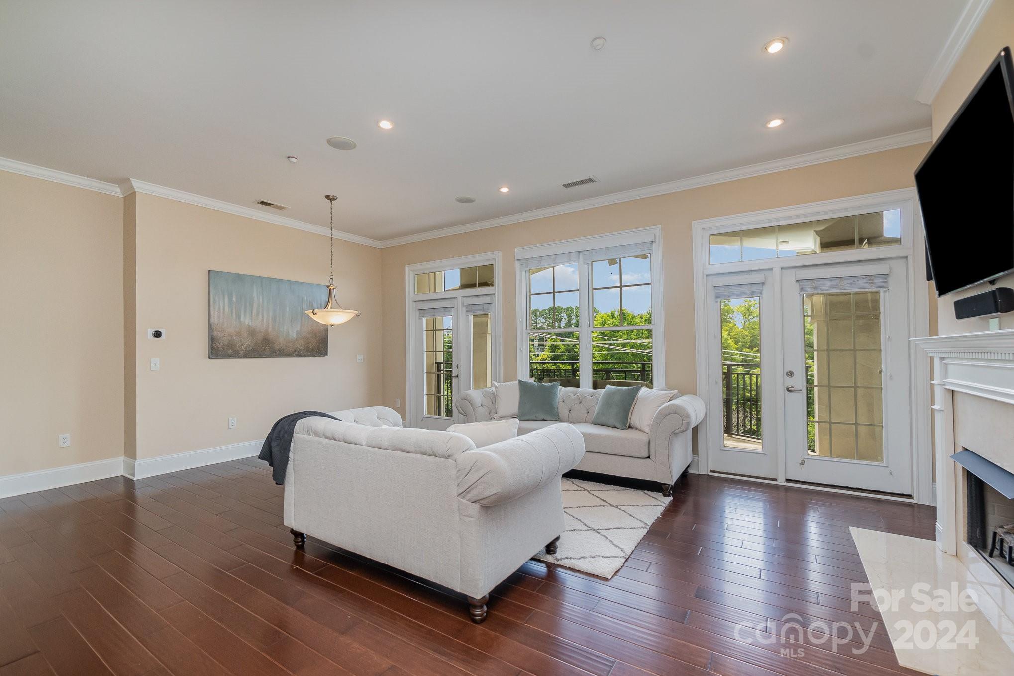 5425 Closeburn Road, Unit 213 Charlotte, NC 28210 - Photo 5 of 32 a living room with furniture and a large window