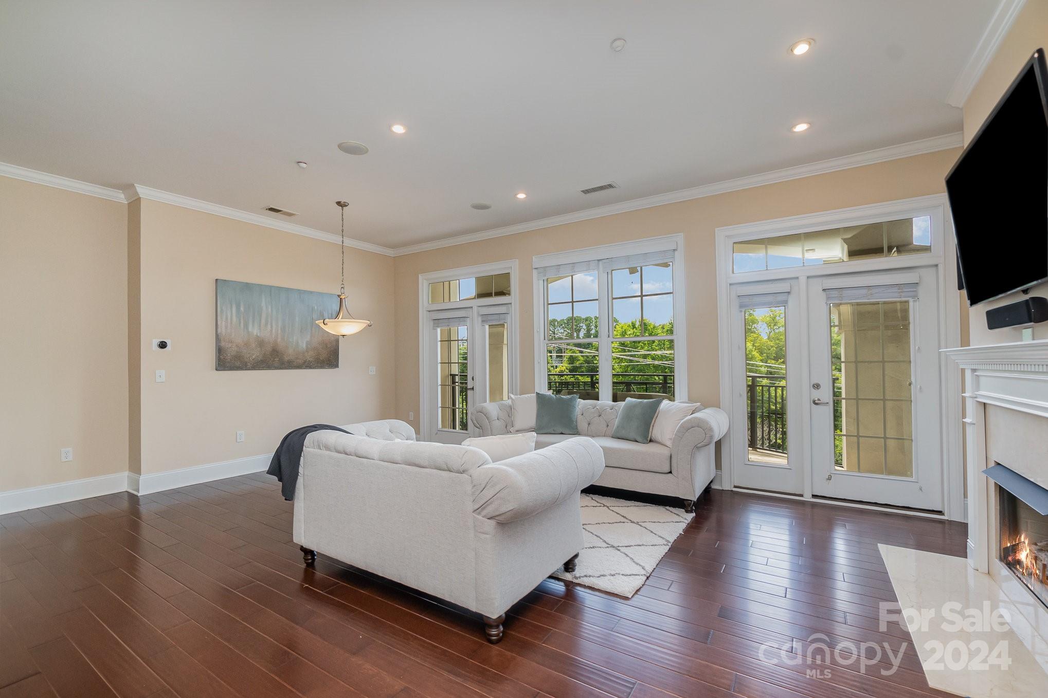 5425 Closeburn Road, Unit 213 Charlotte, NC 28210 - Photo 6 of 32 a living room with furniture and a large window