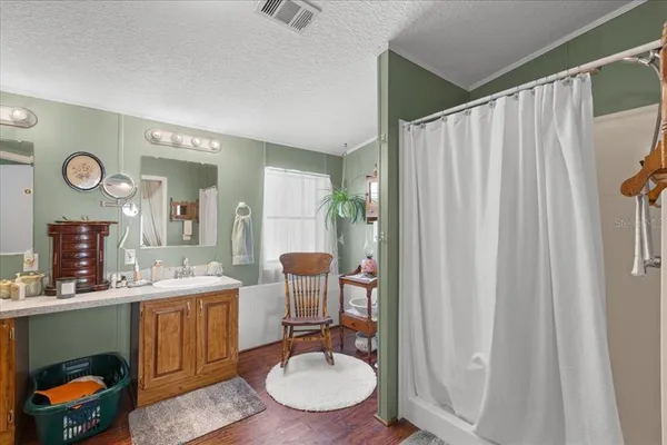 a bathroom with a sink a mirror and a toilet