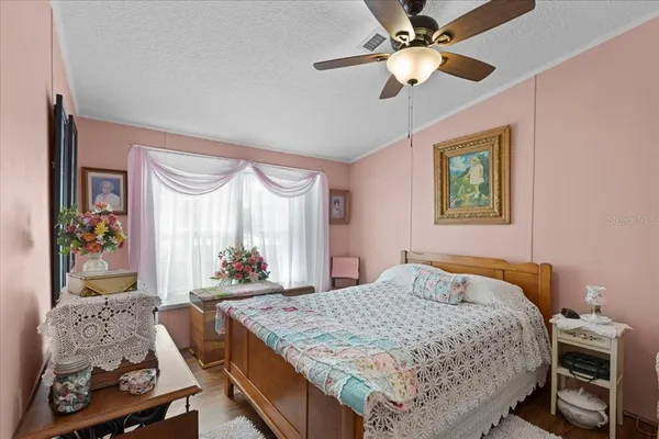 a bed room with a bed and a window