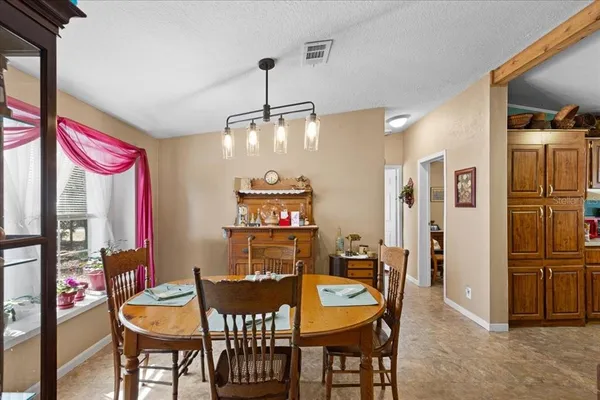 a view of a dining room with furniture