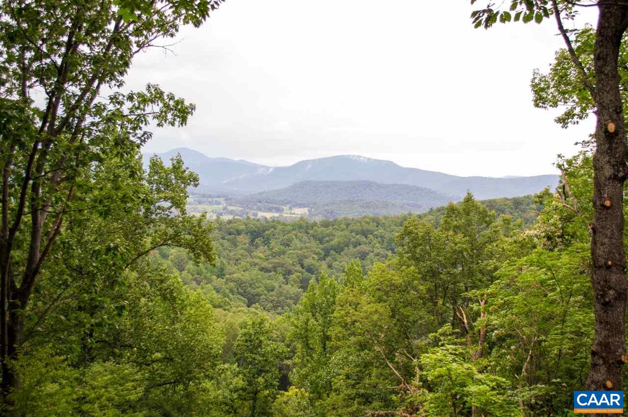 173 Top Ridge Road Stanardsville, VA 22973 - Photo 1 of 40 a view of a large body of water with a mountain in the background