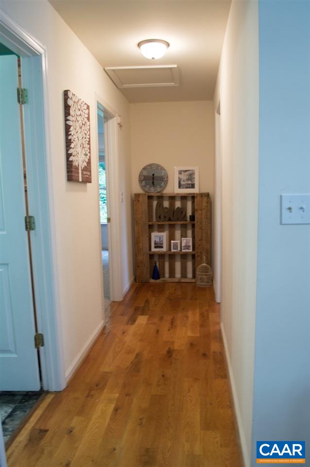 173 Top Ridge Road Stanardsville, VA 22973 - Photo 15 of 40 a view of a hallway to room with wooden floor and closet