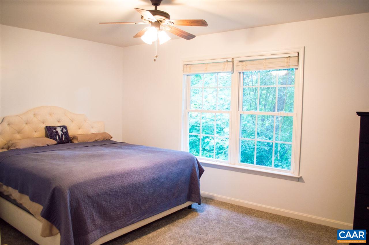 173 Top Ridge Road Stanardsville, VA 22973 - Photo 18 of 40 a bedroom with a bed and a window