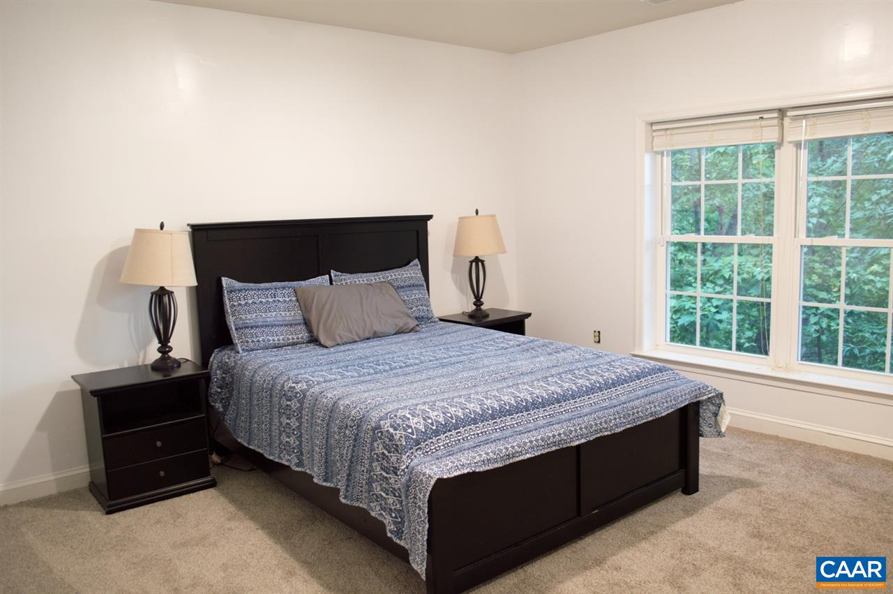 173 Top Ridge Road Stanardsville, VA 22973 - Photo 23 of 40 a bedroom with a bed and window