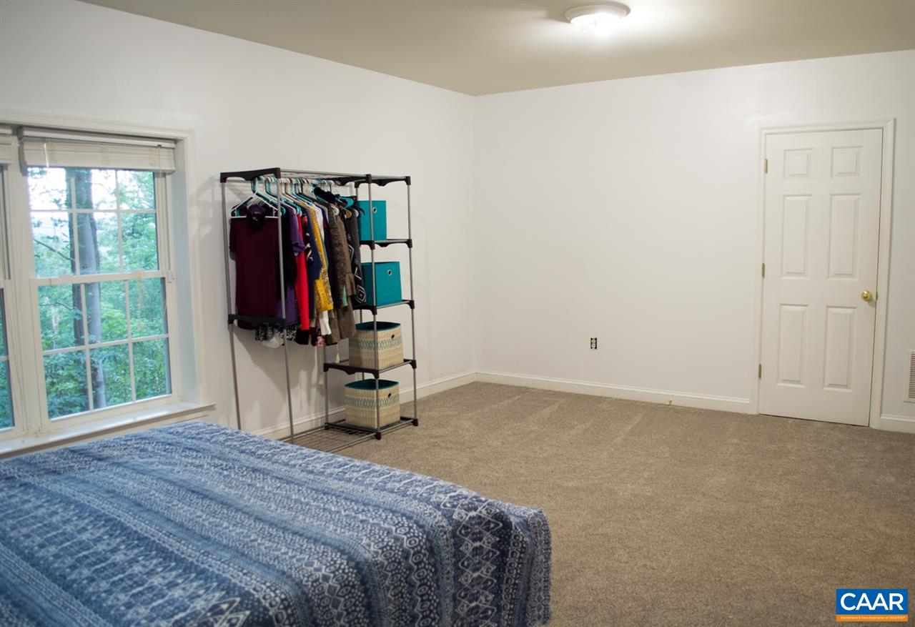 173 Top Ridge Road Stanardsville, VA 22973 - Photo 24 of 40 a bedroom with a bed and a window
