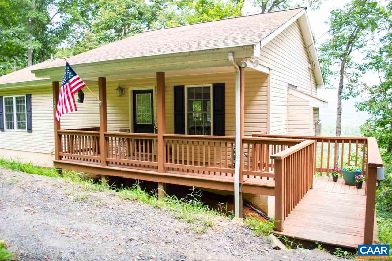 173 Top Ridge Road Stanardsville, VA 22973 - Photo 3 of 40 a view of a house with wooden deck and furniture