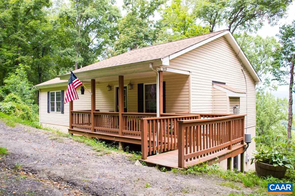 173 Top Ridge Road Stanardsville, VA 22973 - Photo 4 of 40 a view of a house with a yard and deck