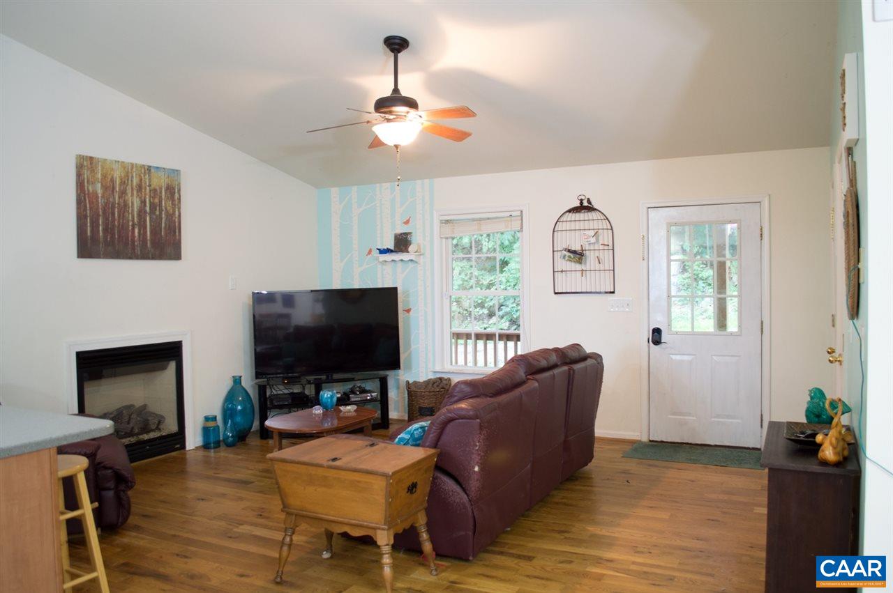 173 Top Ridge Road Stanardsville, VA 22973 - Photo 7 of 40 a living room with furniture and a flat screen tv