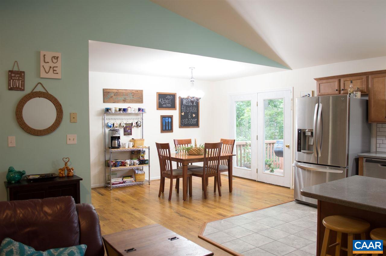 173 Top Ridge Road Stanardsville, VA 22973 - Photo 9 of 40 a dining room with furniture and a floor to ceiling window