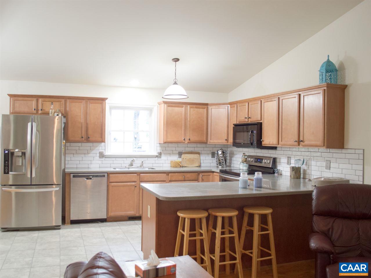 173 Top Ridge Road Stanardsville, VA 22973 - Photo 10 of 40 a kitchen with a sink stove and refrigerator