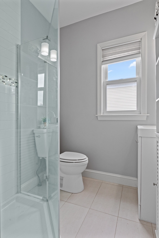 10 Elliott Place, Unit 3F Peabody, MA 01960 - Photo 13 of 15 a bathroom with a toilet sink and vanity