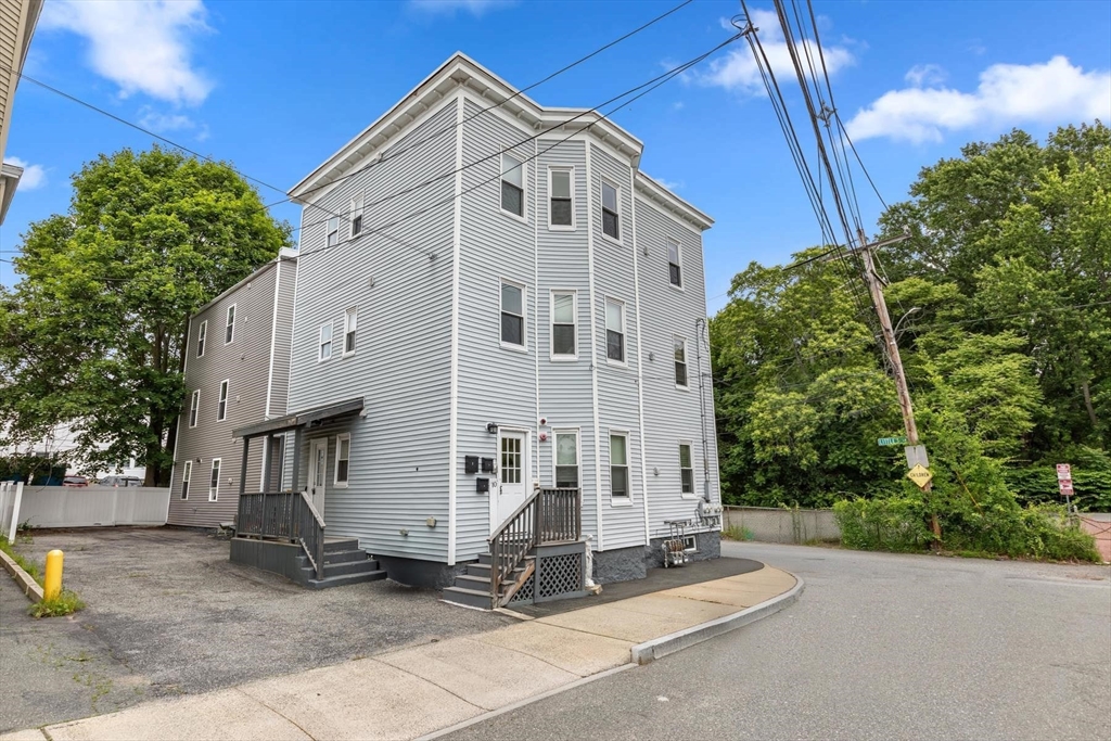 10 Elliott Place, Unit 3F Peabody, MA 01960 - Photo 15 of 15 a white building with a outdoor space
