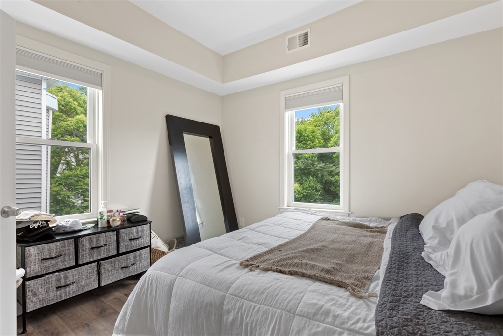 10 Elliott Place, Unit 3F Peabody, MA 01960 - Photo 8 of 15 a bedroom with a bed and a window