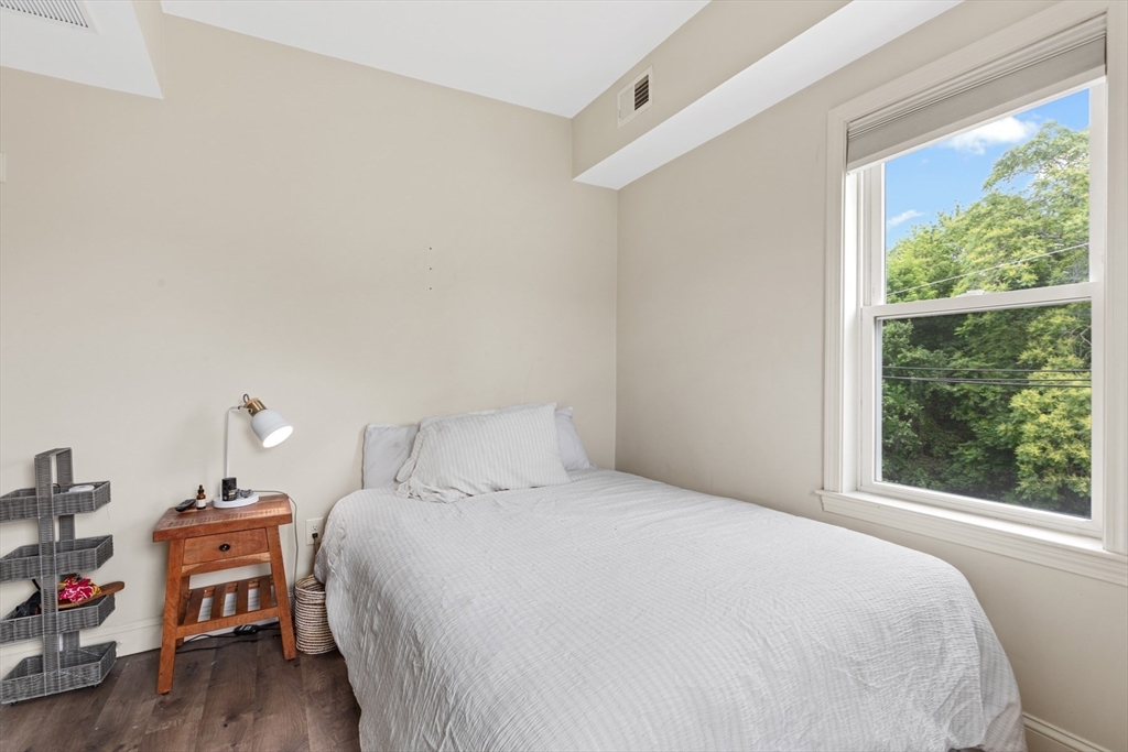 10 Elliott Place, Unit 3F Peabody, MA 01960 - Photo 10 of 15 a bedroom with a bed and a window