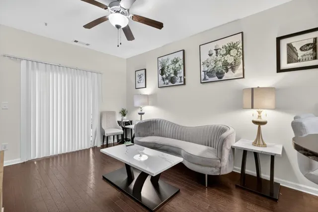 a living room with furniture and a window