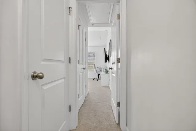 a view of a livingroom from a hallway