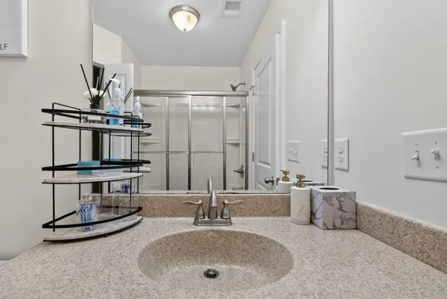 a bathroom with a sink and a mirror