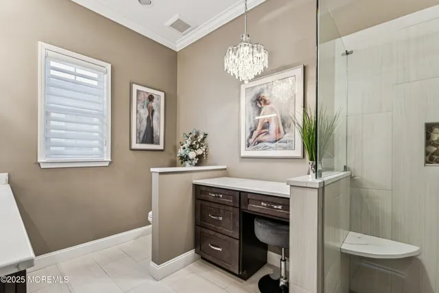a living room with furniture and floor to ceiling windows