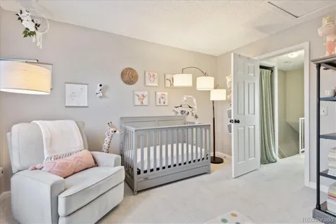 a bedroom with a bed and a couch
