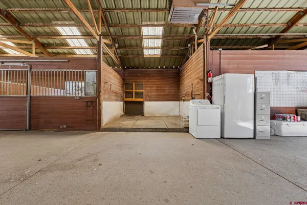 a kitchen with a refrigerator and a sink