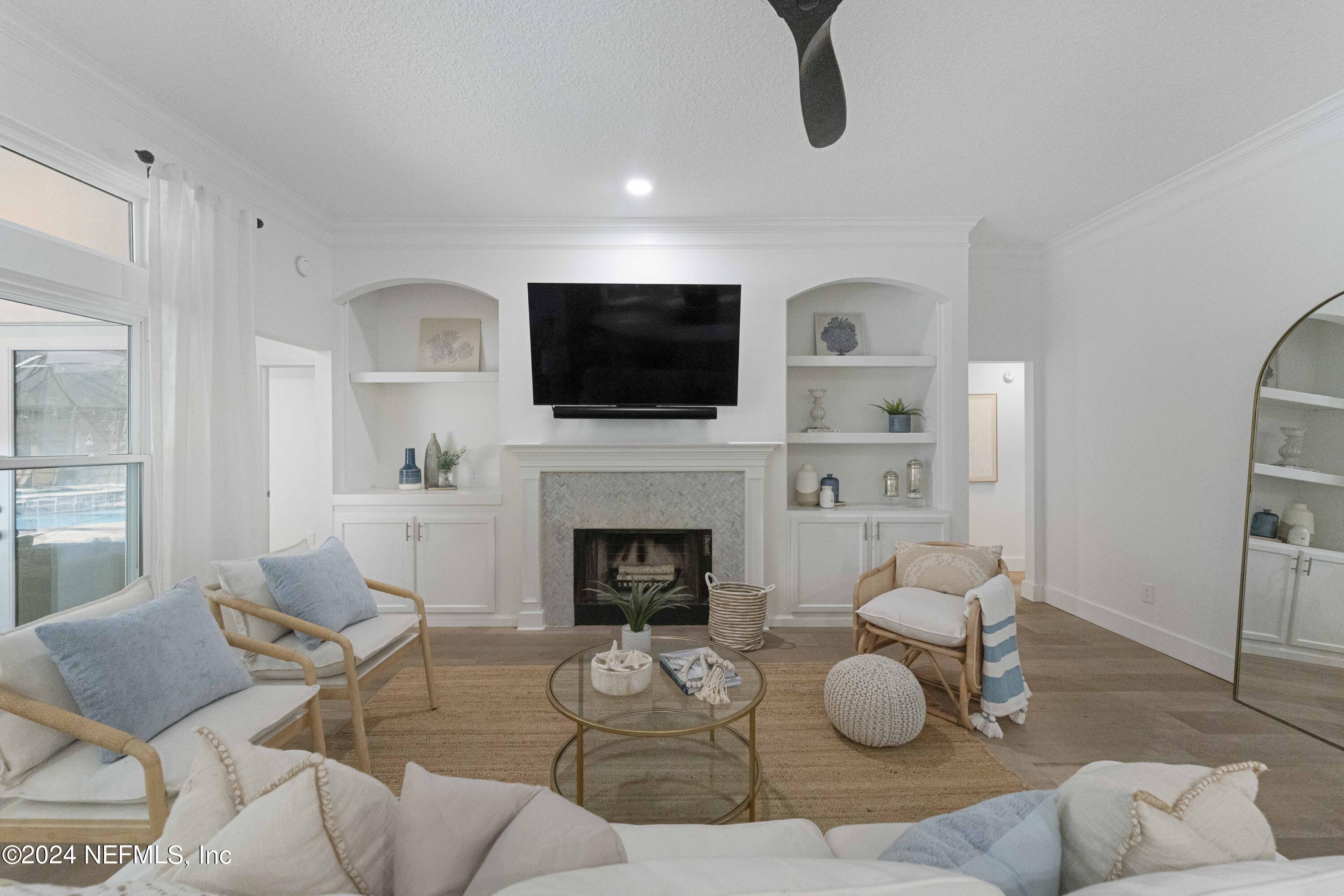 804 Mill Stream Road Ponte Vedra Beach, FL 32082 - Photo 19 of 67 a living room with furniture a flat screen tv and a fireplace