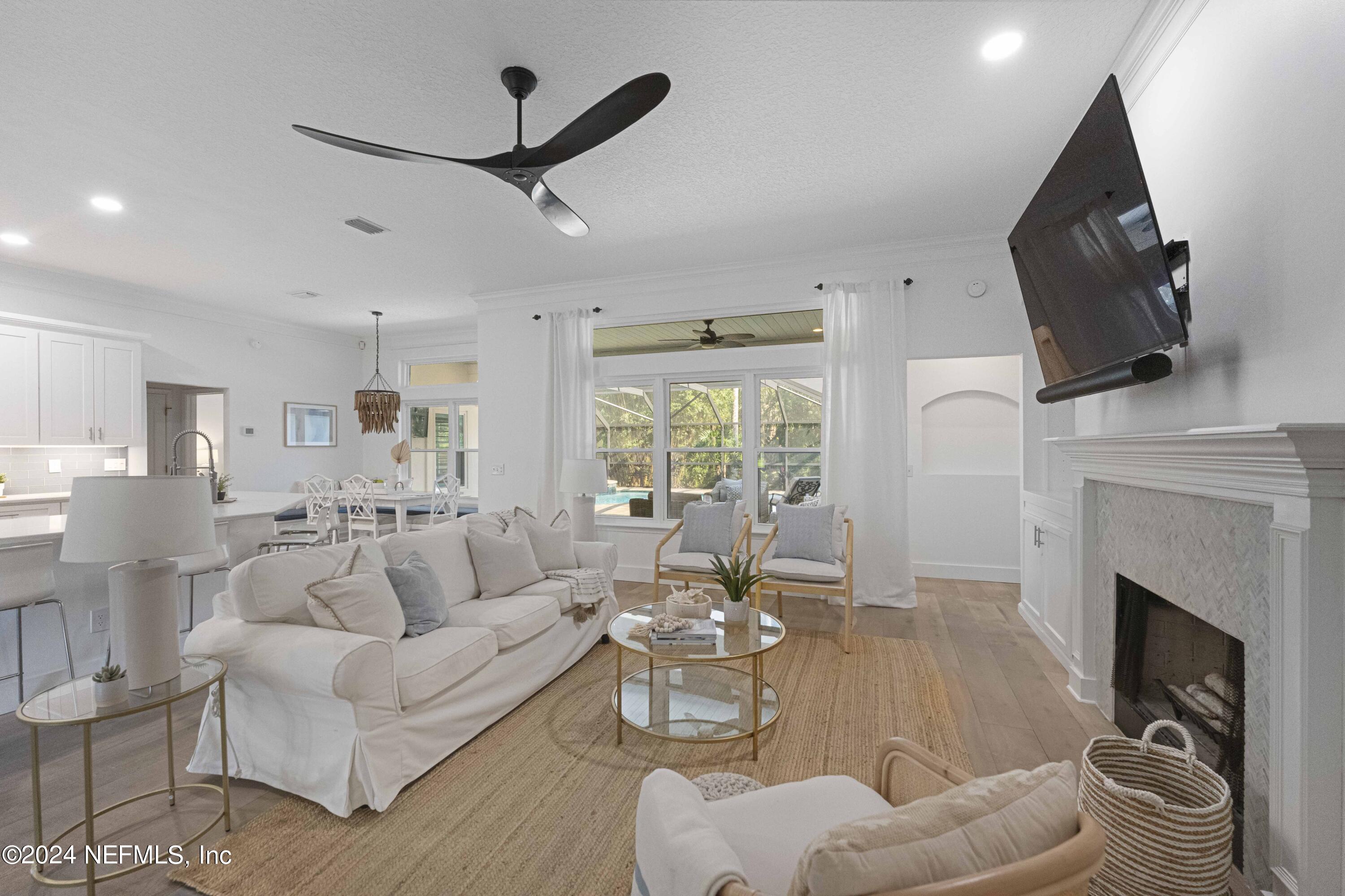 804 Mill Stream Road Ponte Vedra Beach, FL 32082 - Photo 20 of 67 a living room with furniture a fireplace and a flat screen tv
