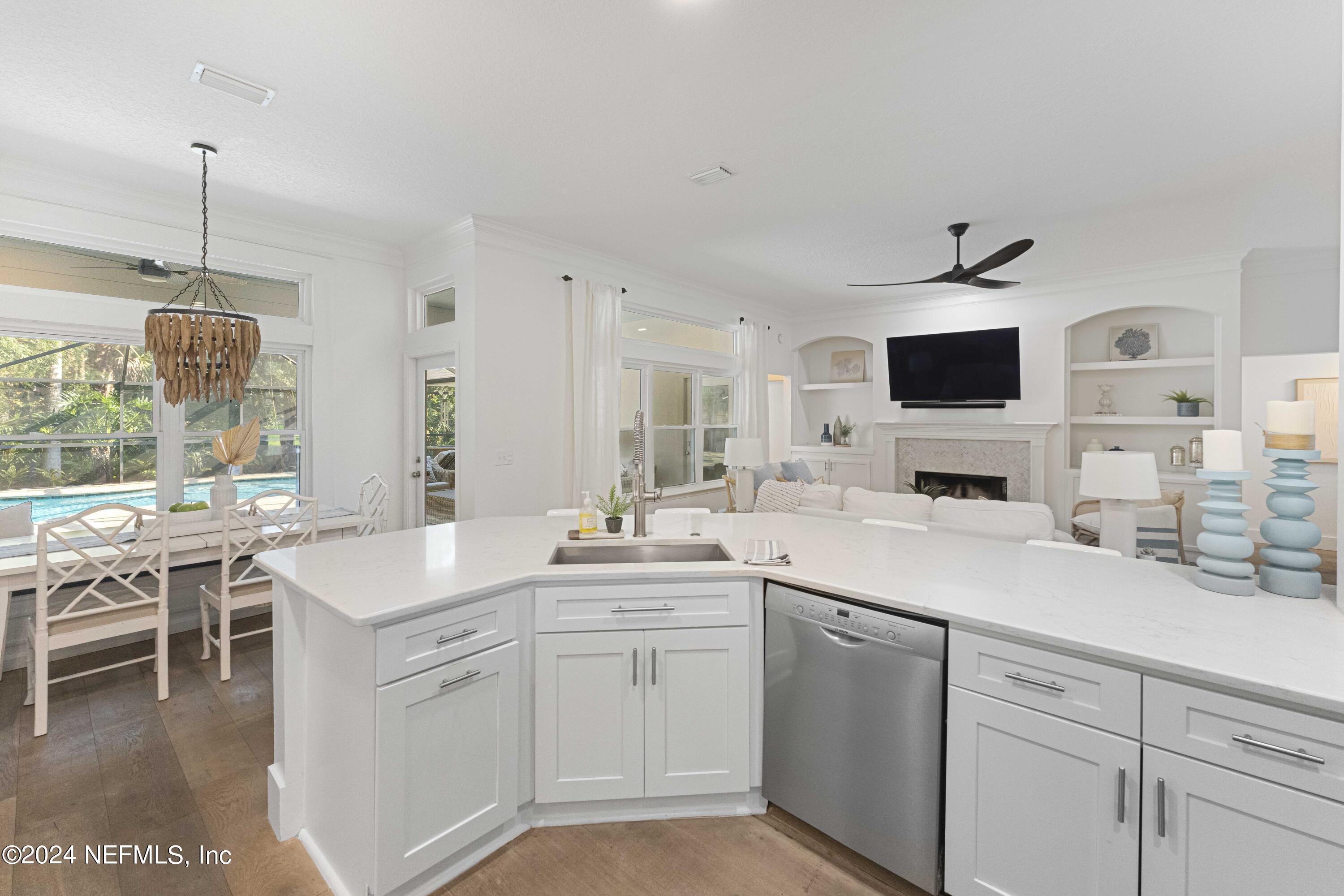 804 Mill Stream Road Ponte Vedra Beach, FL 32082 - Photo 24 of 67 a kitchen with a sink stove and cabinets