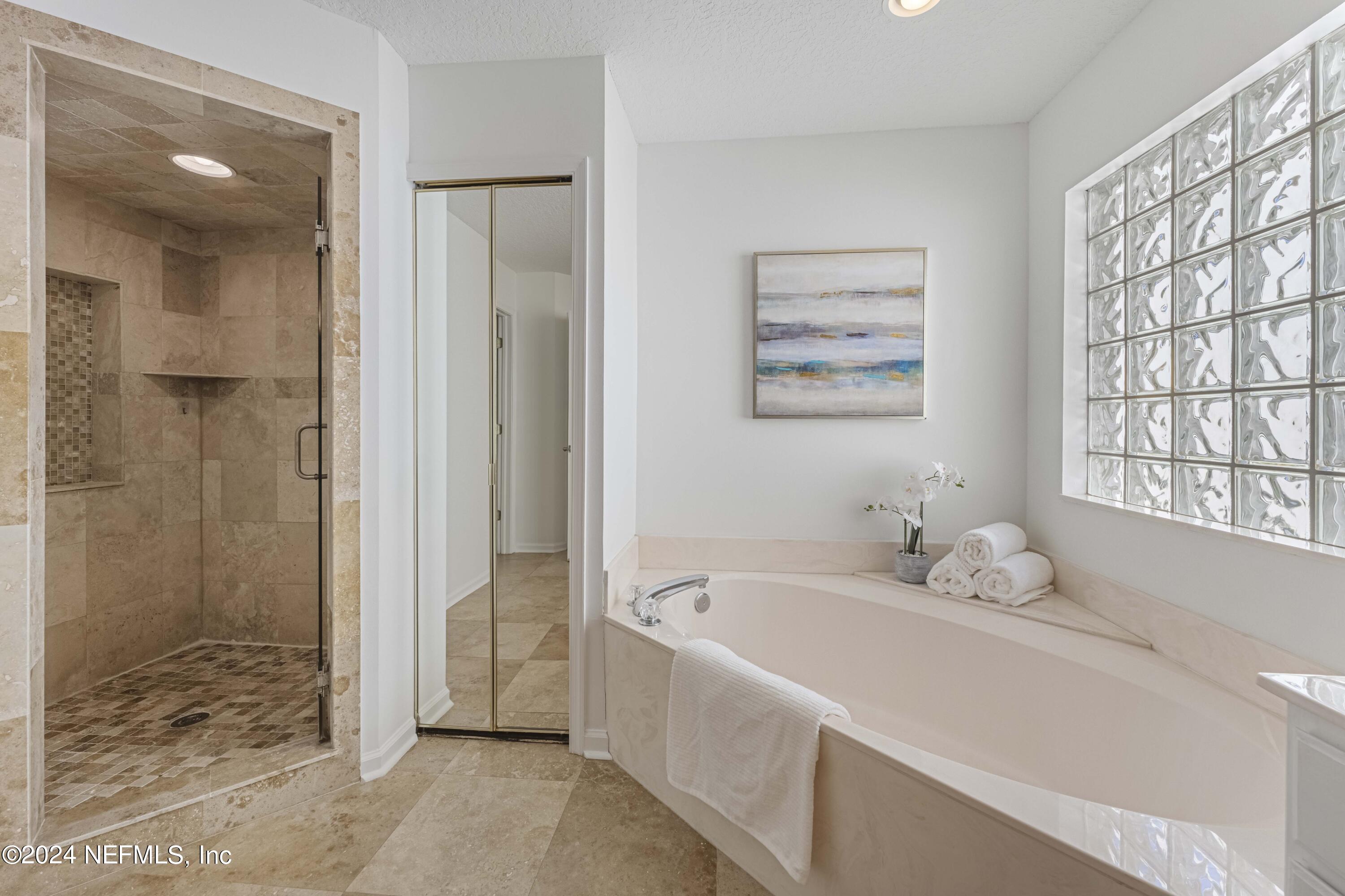 804 Mill Stream Road Ponte Vedra Beach, FL 32082 - Photo 29 of 67 a bathroom with a tub sink and shower