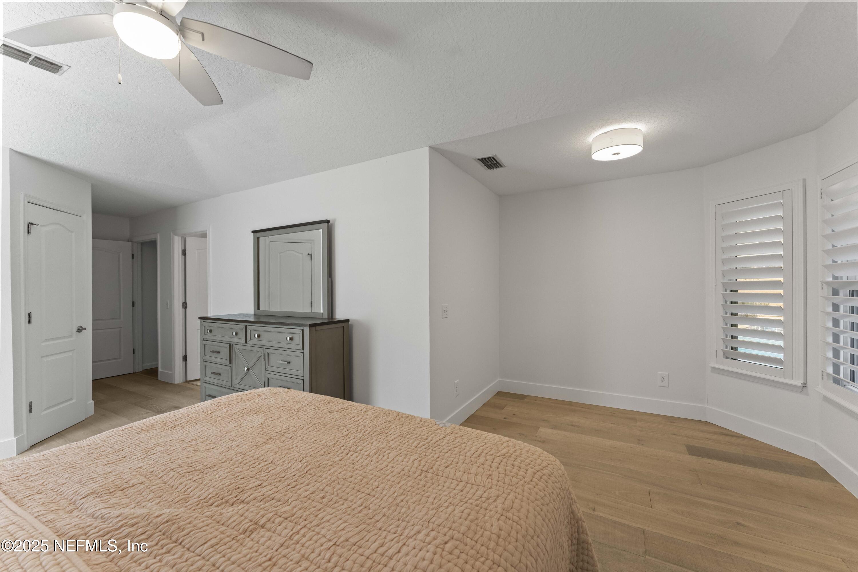 804 Mill Stream Road Ponte Vedra Beach, FL 32082 - Photo 32 of 67 a bedroom with a bed and a dresser