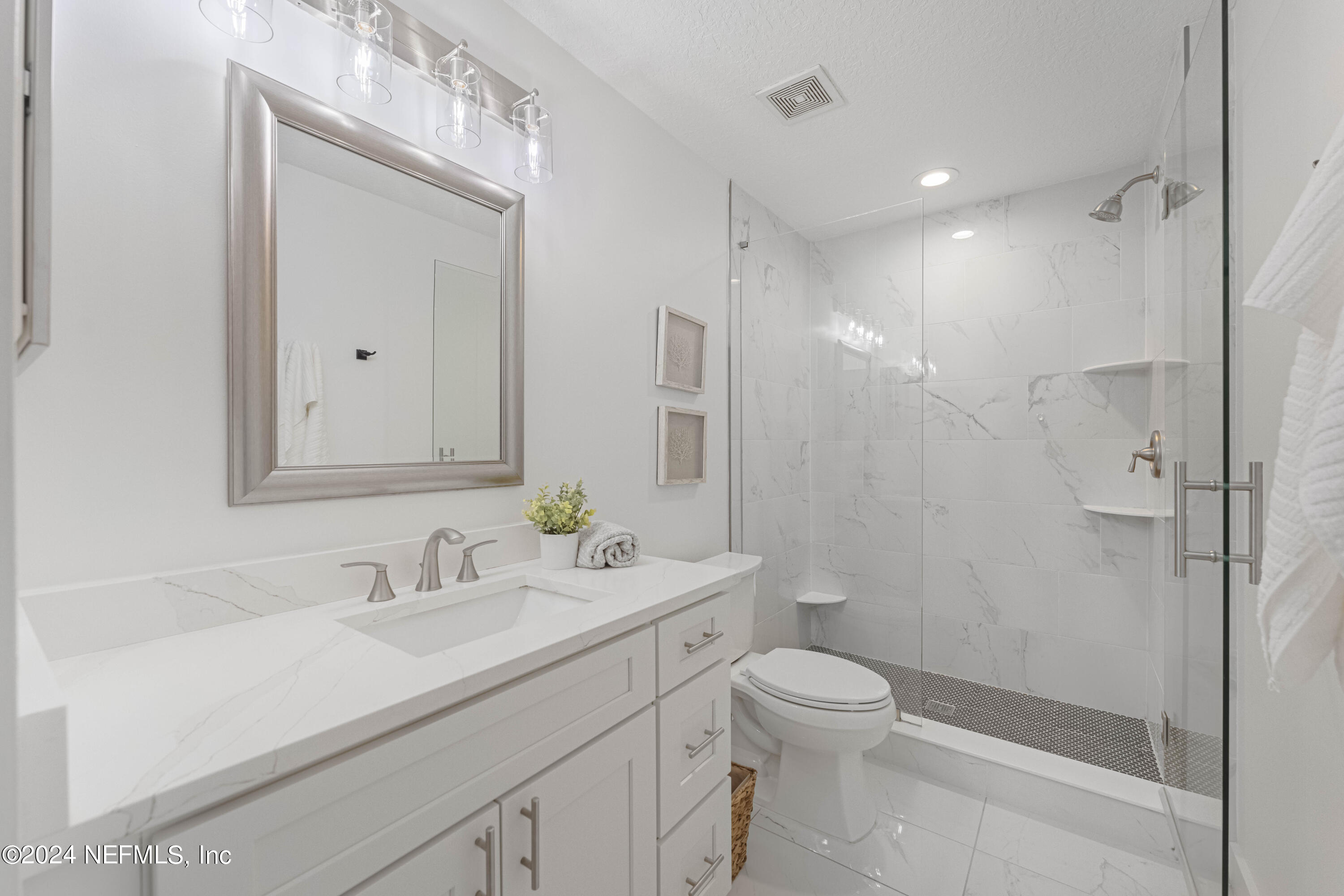 804 Mill Stream Road Ponte Vedra Beach, FL 32082 - Photo 35 of 67 a bathroom with a sink a toilet and shower