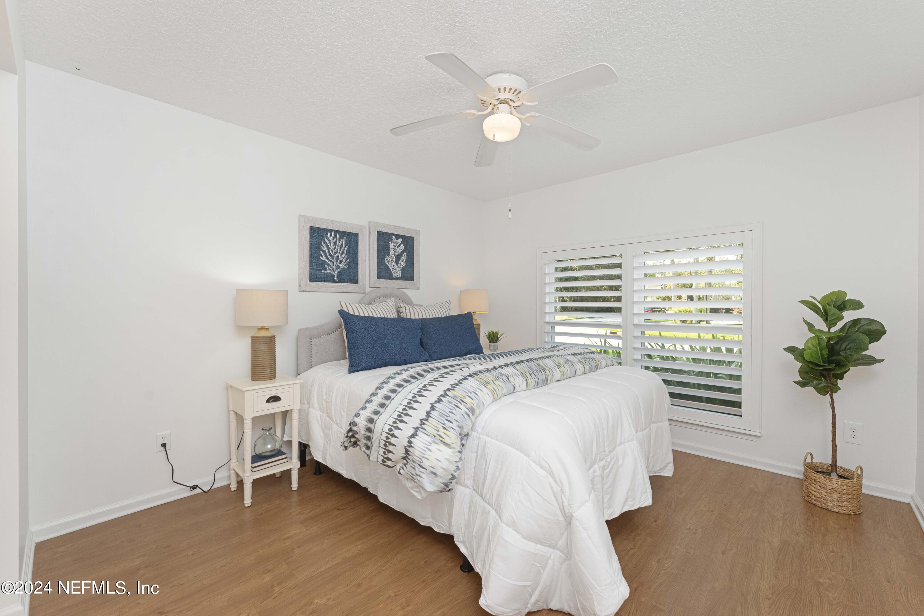 804 Mill Stream Road Ponte Vedra Beach, FL 32082 - Photo 37 of 67 a bedroom with a bed and a potted plant