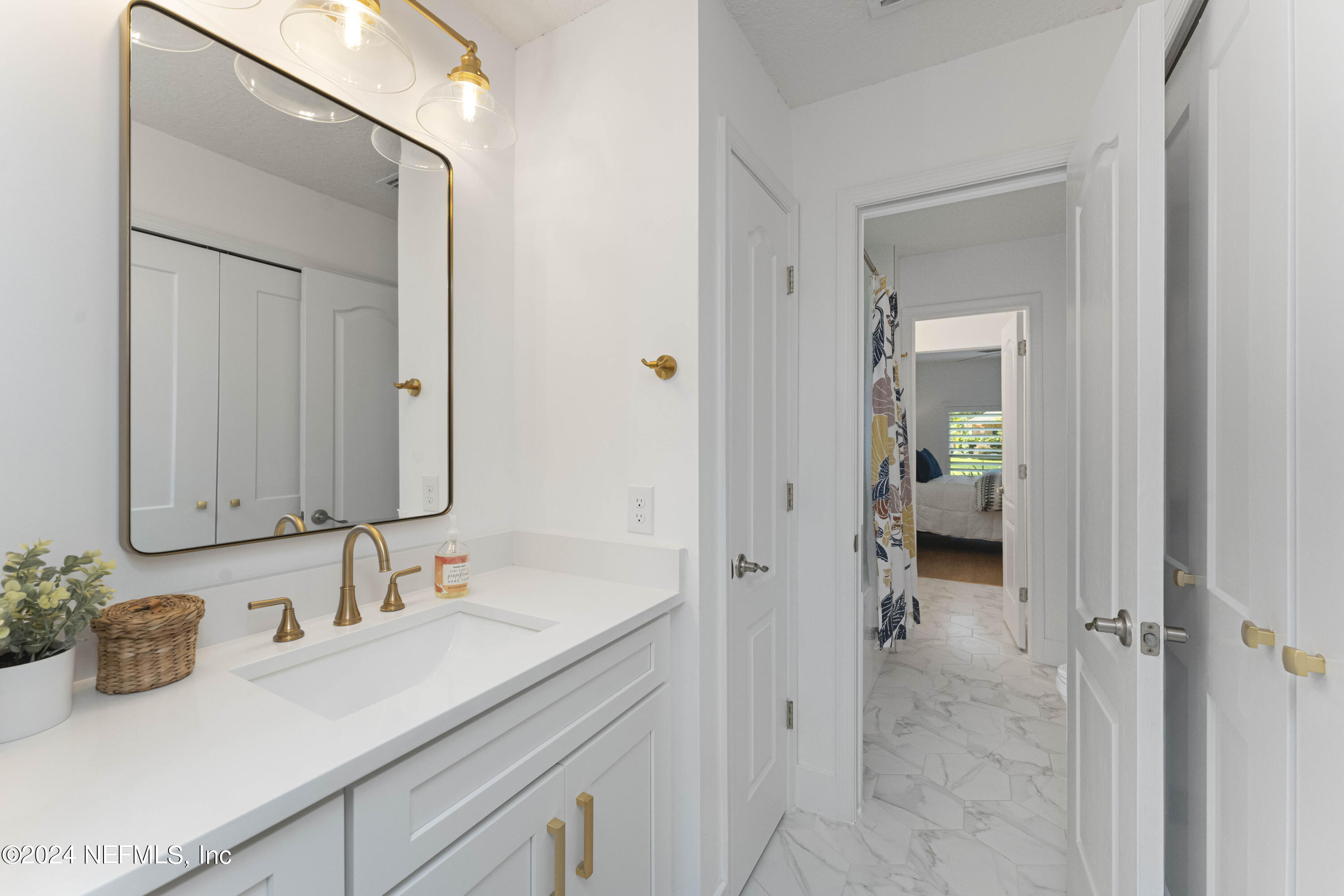 804 Mill Stream Road Ponte Vedra Beach, FL 32082 - Photo 38 of 67 a bathroom with a sink and a mirror
