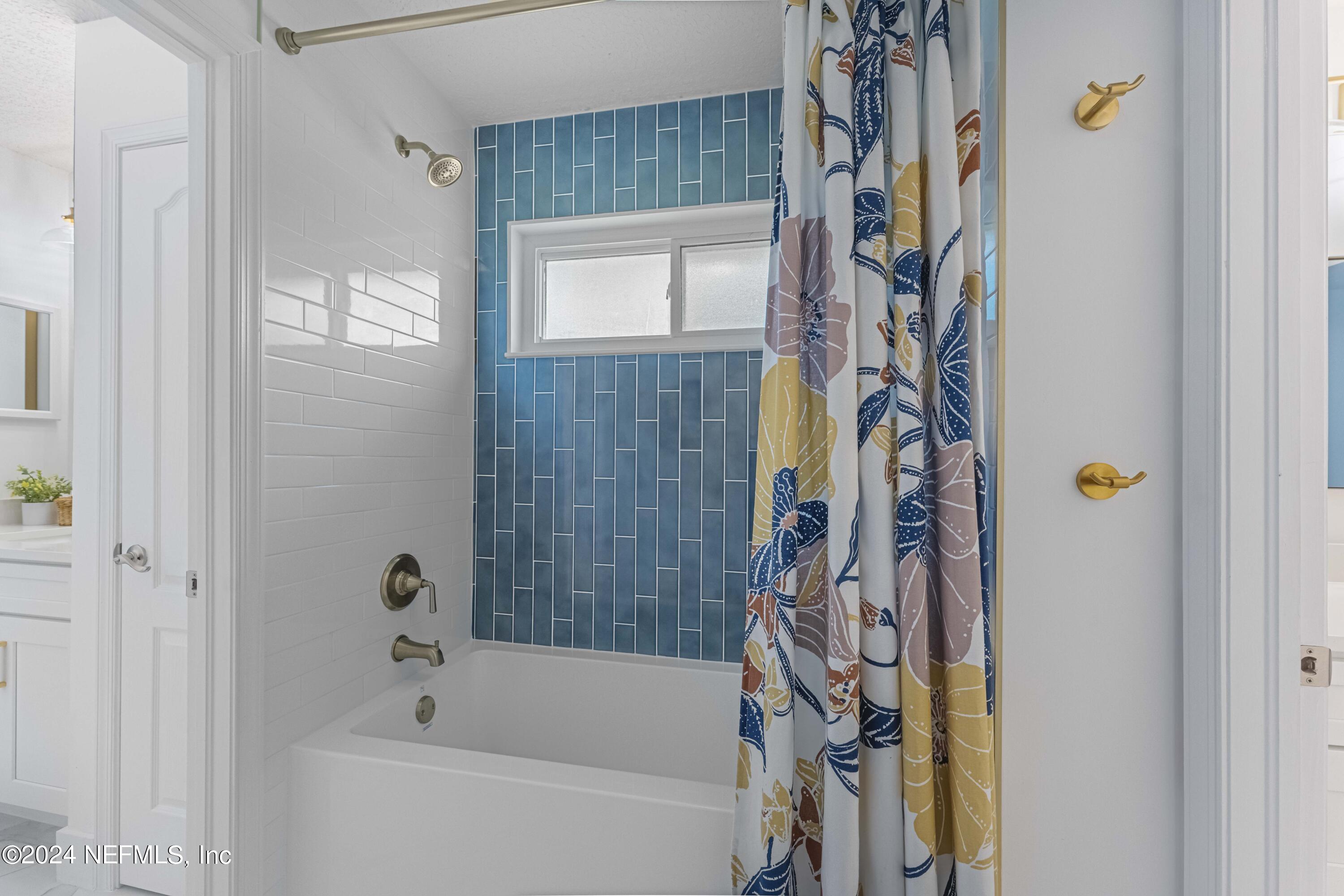 804 Mill Stream Road Ponte Vedra Beach, FL 32082 - Photo 39 of 67 a bathroom with a bathtub and a shower