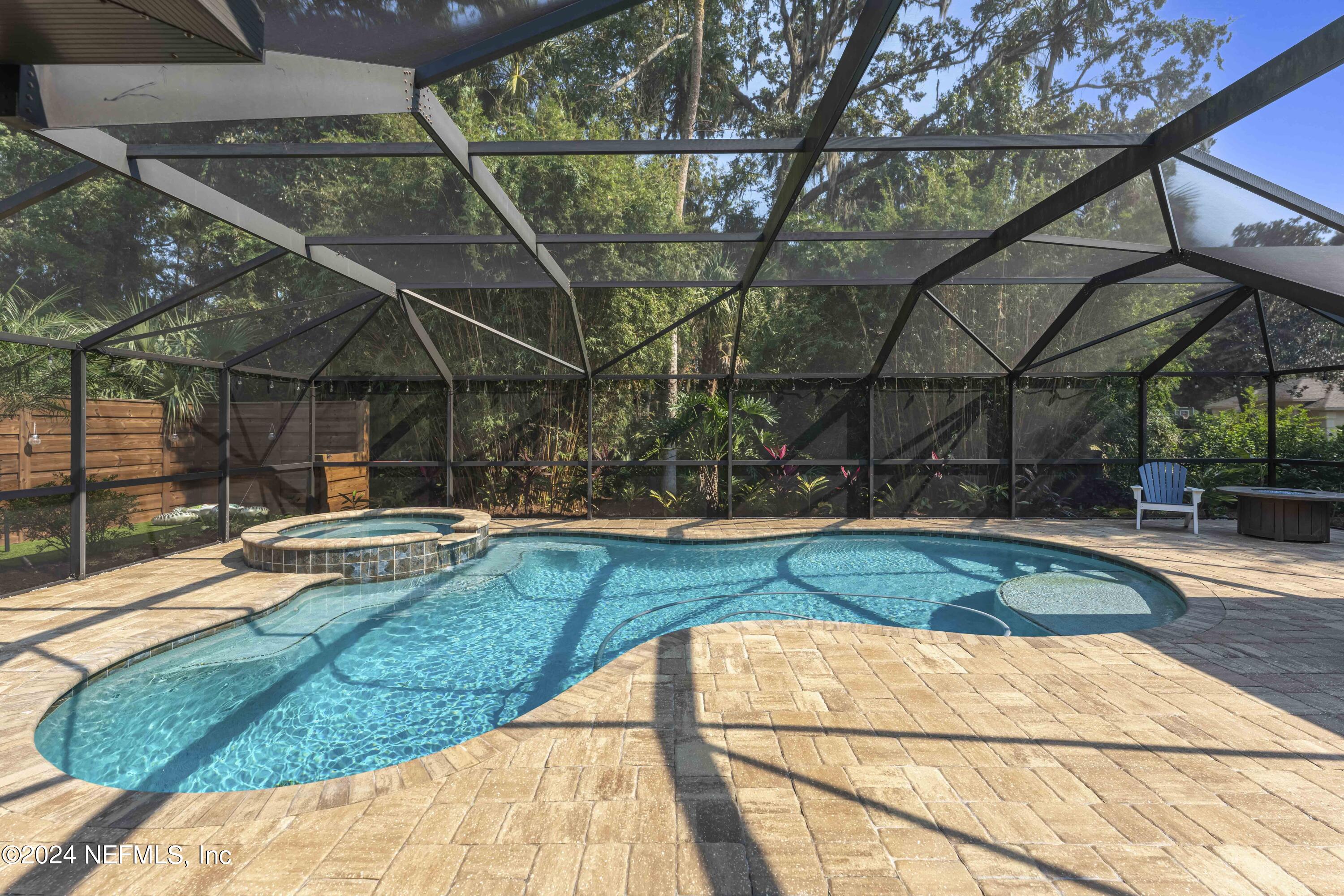 804 Mill Stream Road Ponte Vedra Beach, FL 32082 - Photo 5 of 67 a view of a backyard with a small pool