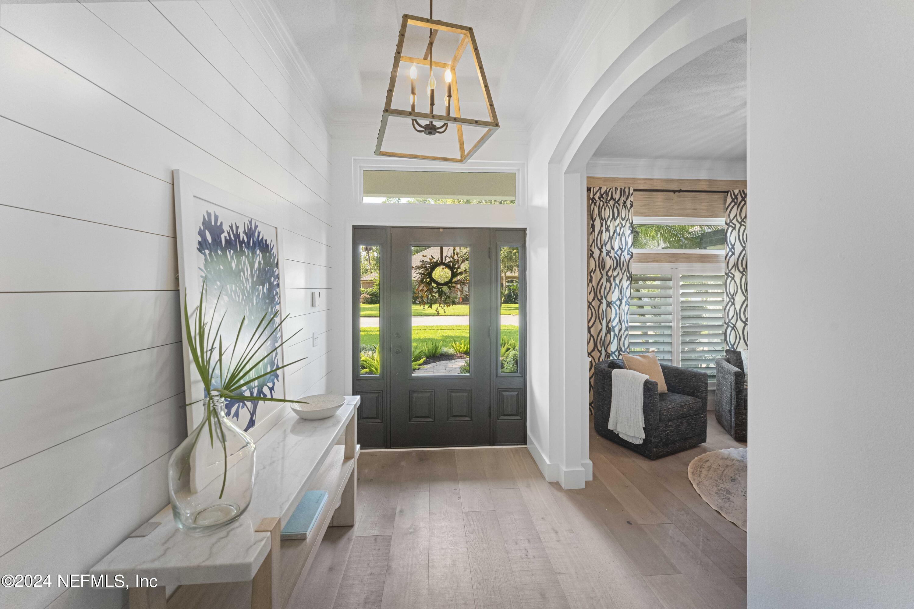 804 Mill Stream Road Ponte Vedra Beach, FL 32082 - Photo 10 of 67 a porch with seating space and a entryway
