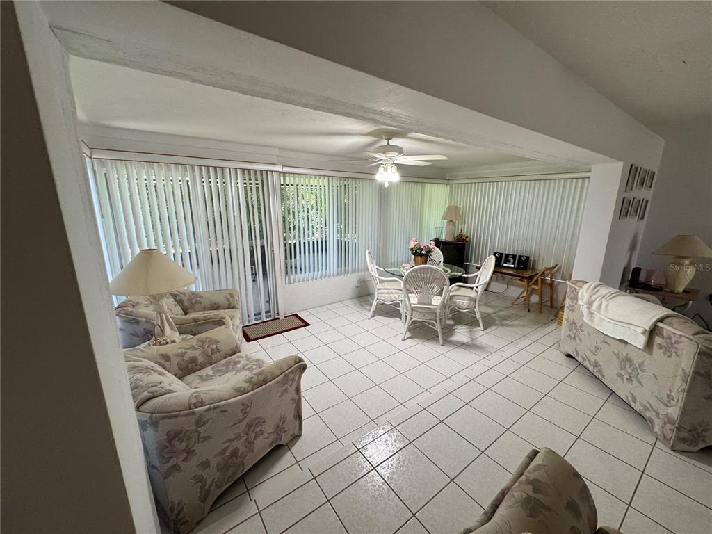 239 Hammock Terrace Venice, FL 34293 - Photo 6 of 13 a living room with furniture and a large window