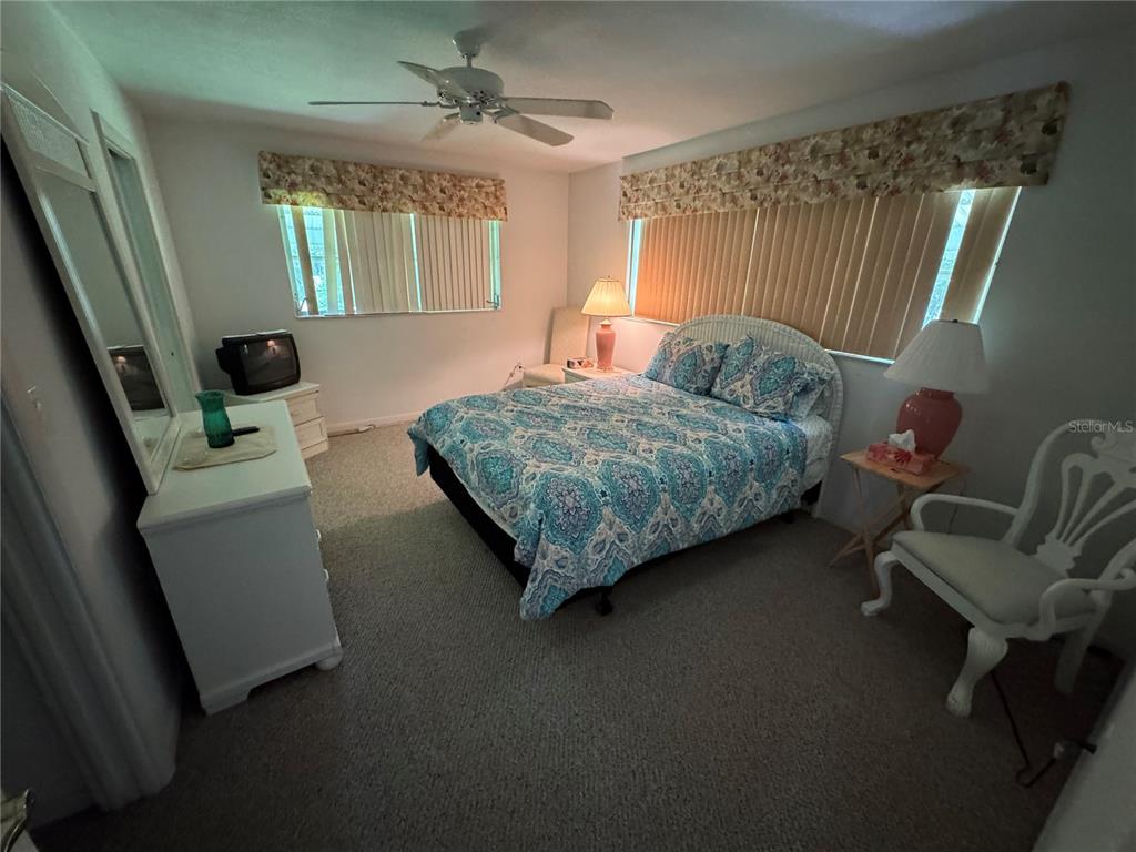 239 Hammock Terrace Venice, FL 34293 - Photo 9 of 13 a bed room with a bed and a chair